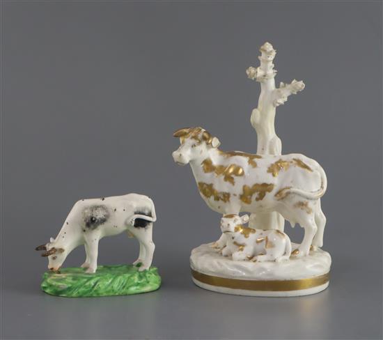 A Derby figure of a cow grazing and a similar group of a cow and calf, c.1820-40, H. 5.5cm and 14.5cm